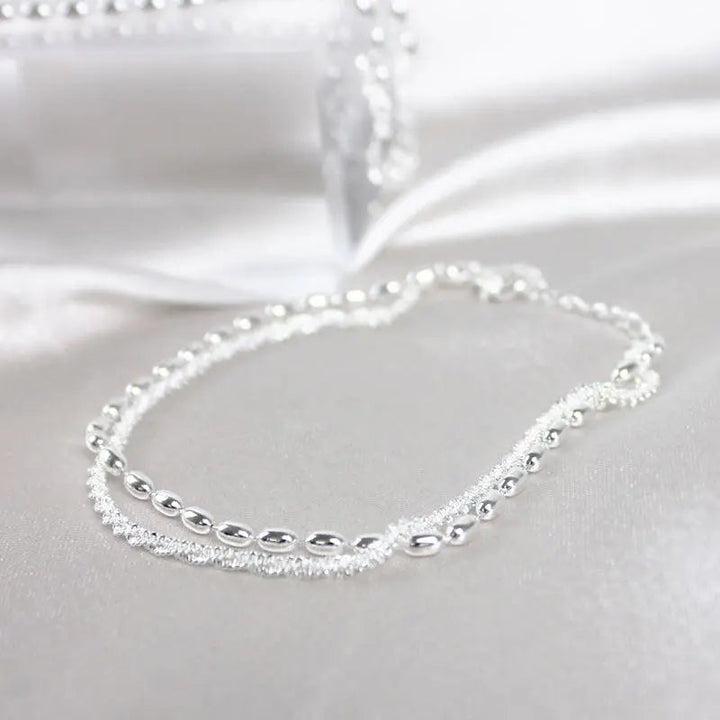 Elegantes Silberfarbenes Armband Set mit Zirkonia Steinen