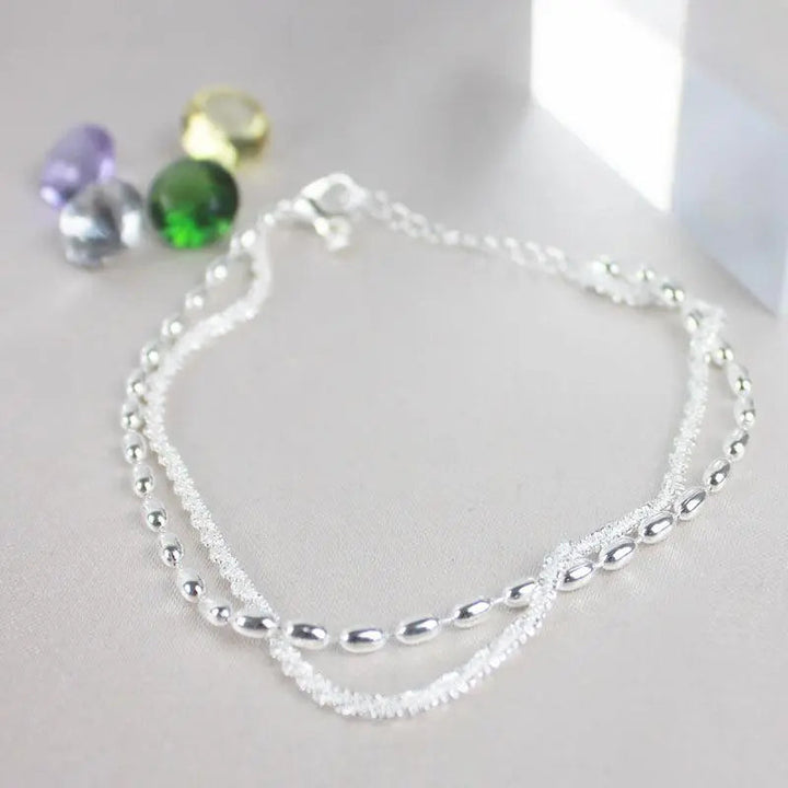 Elegantes Silberfarbenes Armband Set mit Zirkonia Steinen