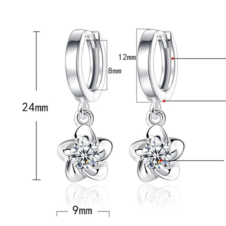 Bague en argent massif ornée de zirconiums lilas et blancs