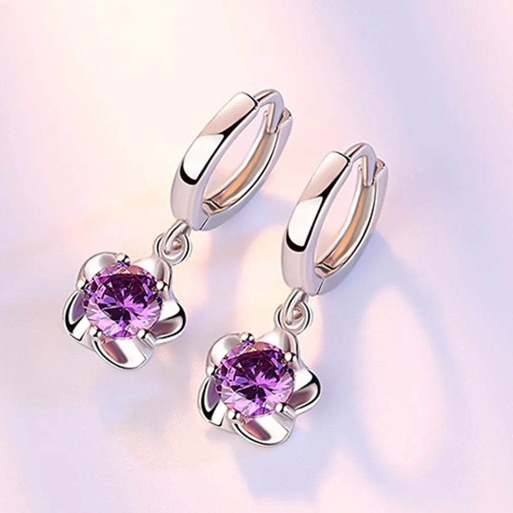 Bague en argent massif ornée de zirconiums lilas et blancs