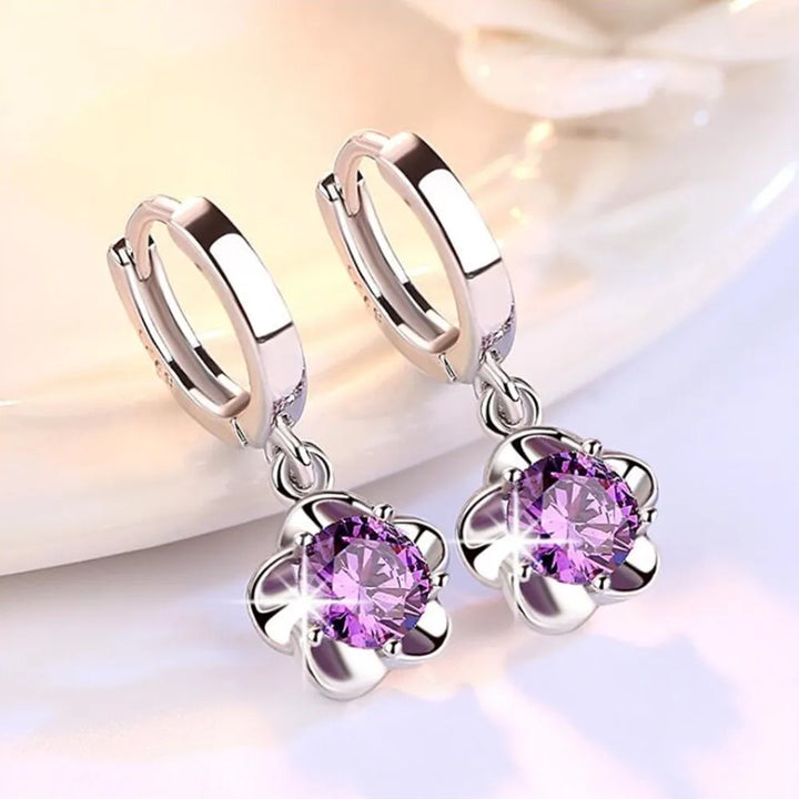 Bague en argent massif ornée de zirconiums lilas et blancs