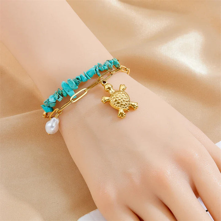 Exklusives Armband aus Edelstahl mit türkisfarbenem Schildkrötenmotiv