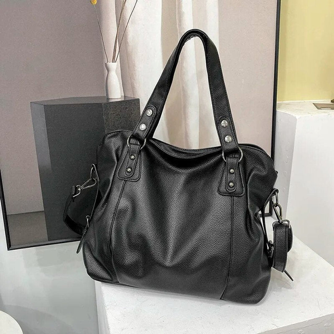 Damen große elegante Kunstleder-Schultertasche mit Nieten in Schwarz