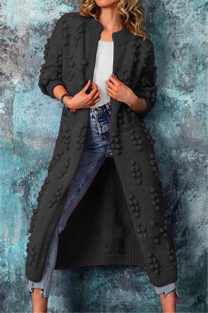 Damen lange Strickjacke mit Pompon Details in Schwarz