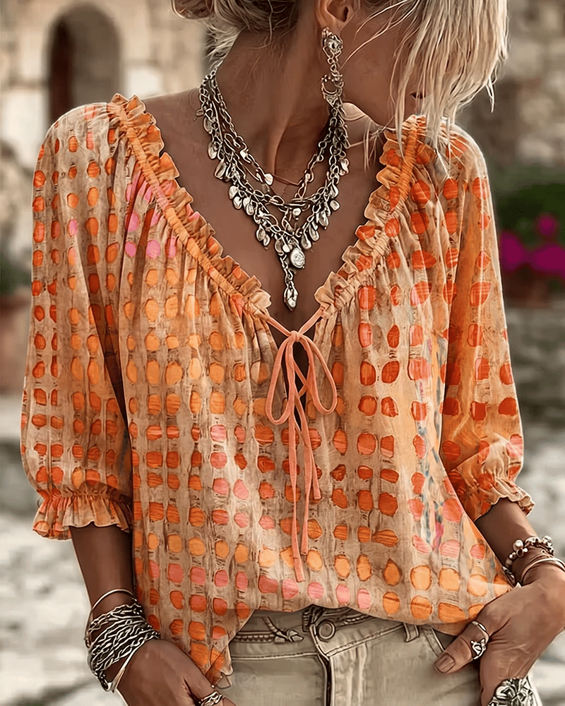 Elegante Damen Bluse mit Puffärmeln und Punkten in Orange