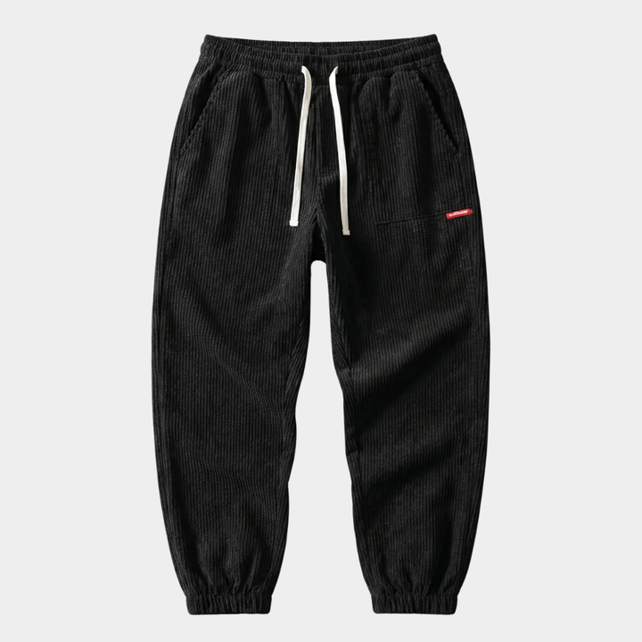 Herren Baggy Joggers mit Rippendetail und Raffung in Schwarz